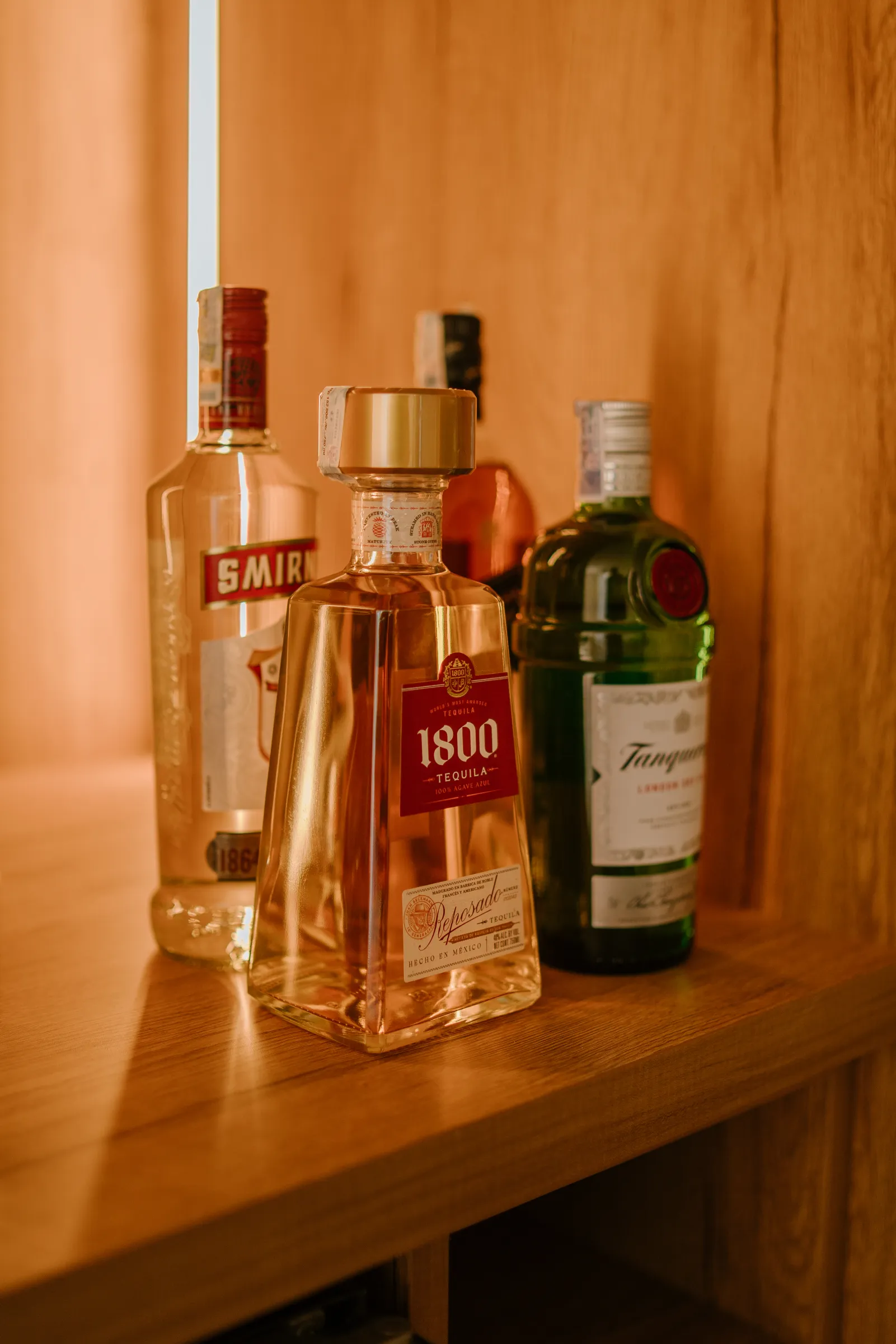 Wooden bar with bottles in a villa