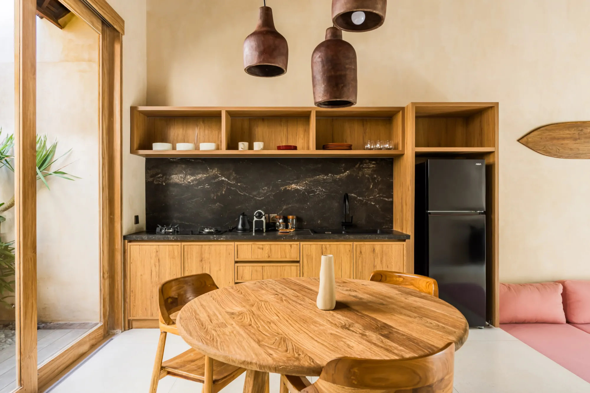 Dining table with hardwood accents overlooking kitchen and garden