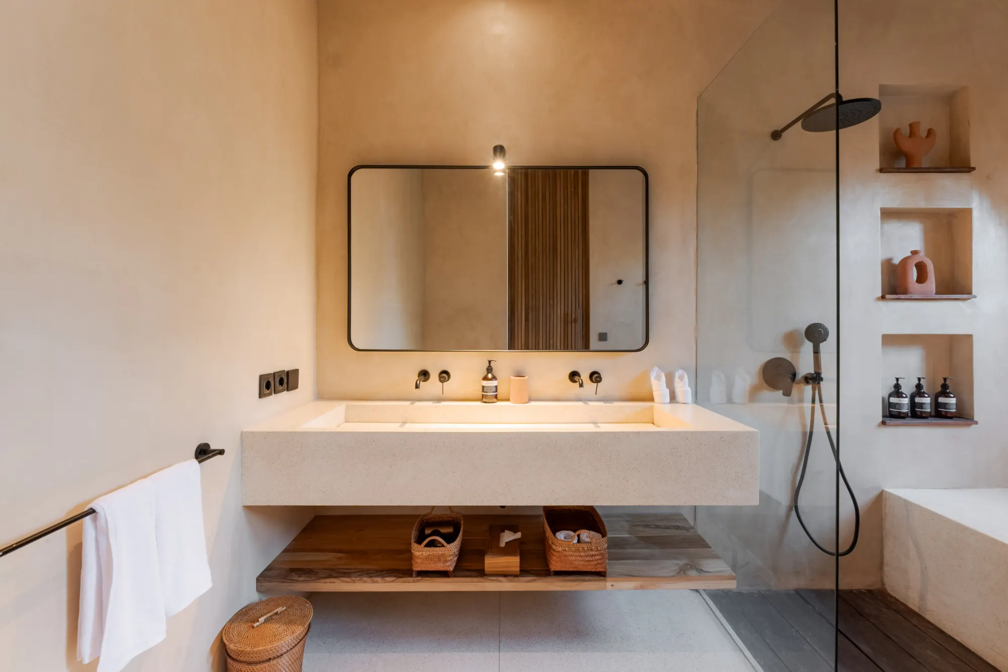 Minimalist bathroom with floating vanity and storage cubbies