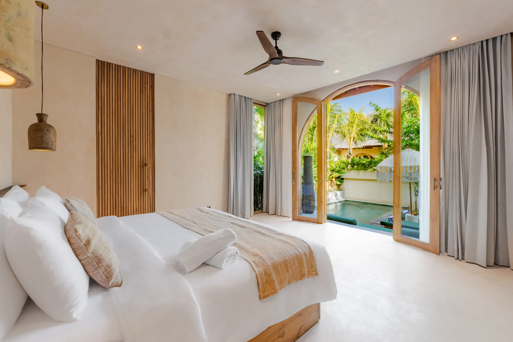 Bedroom with lounge area and sliding glass patio doors