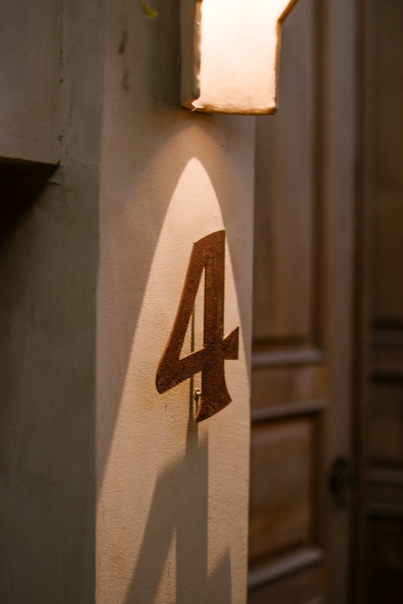 Illuminated room number 5 on exterior wall
