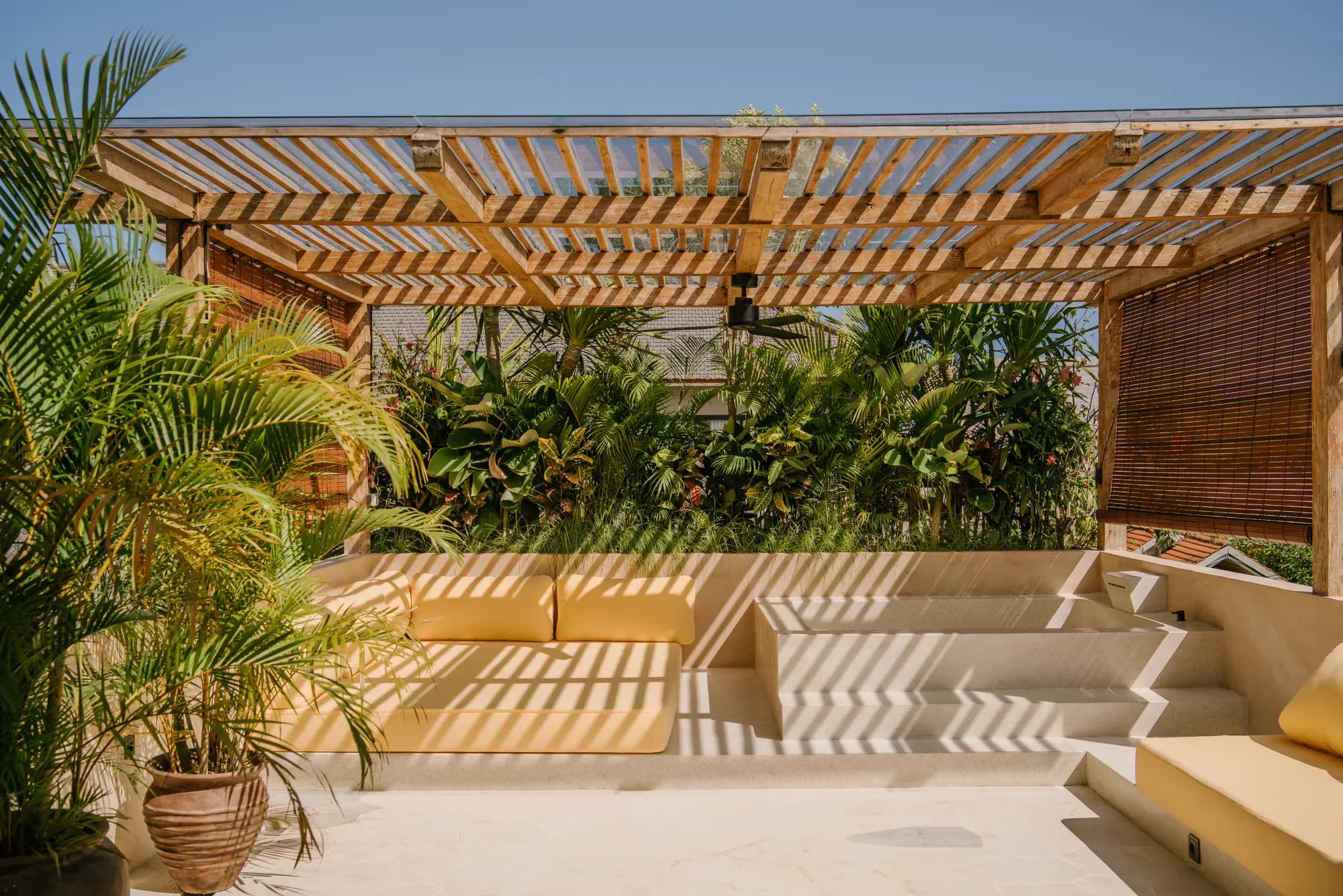 Shaded courtyard with pergola and outdoor furniture
