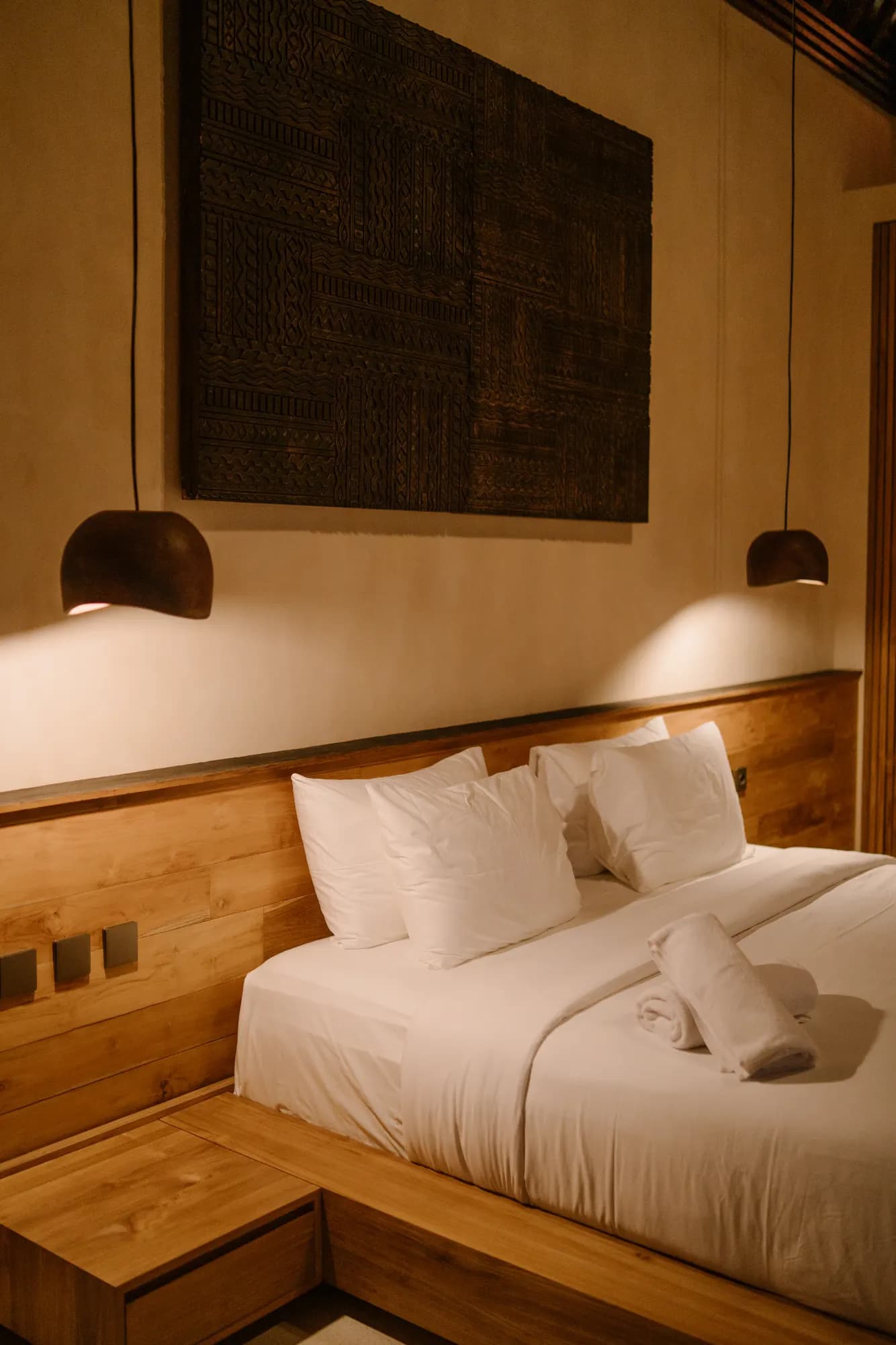 Twin beds with wall sconce and modern decor