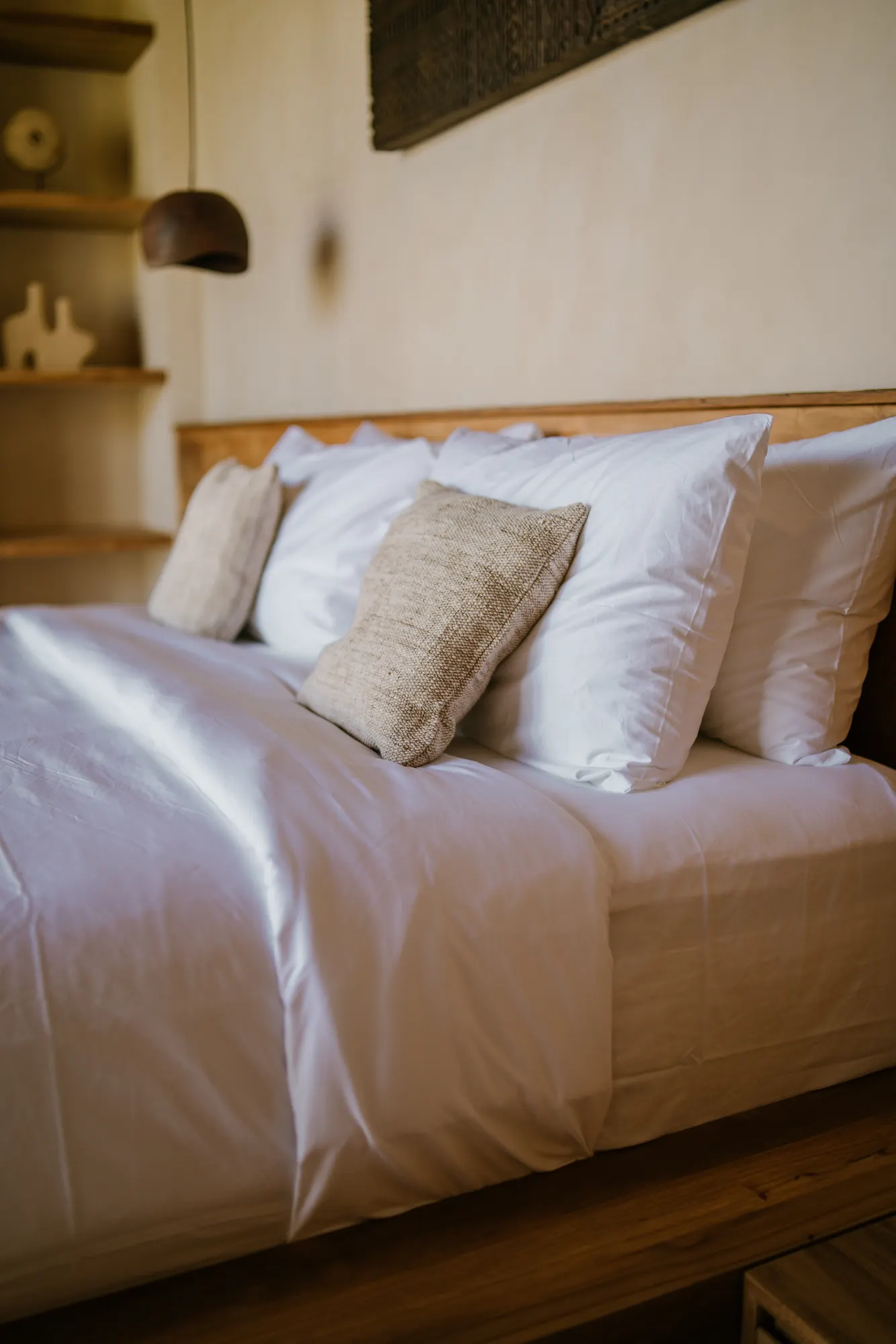 Modern bedroom with wooden bed frame and wall art