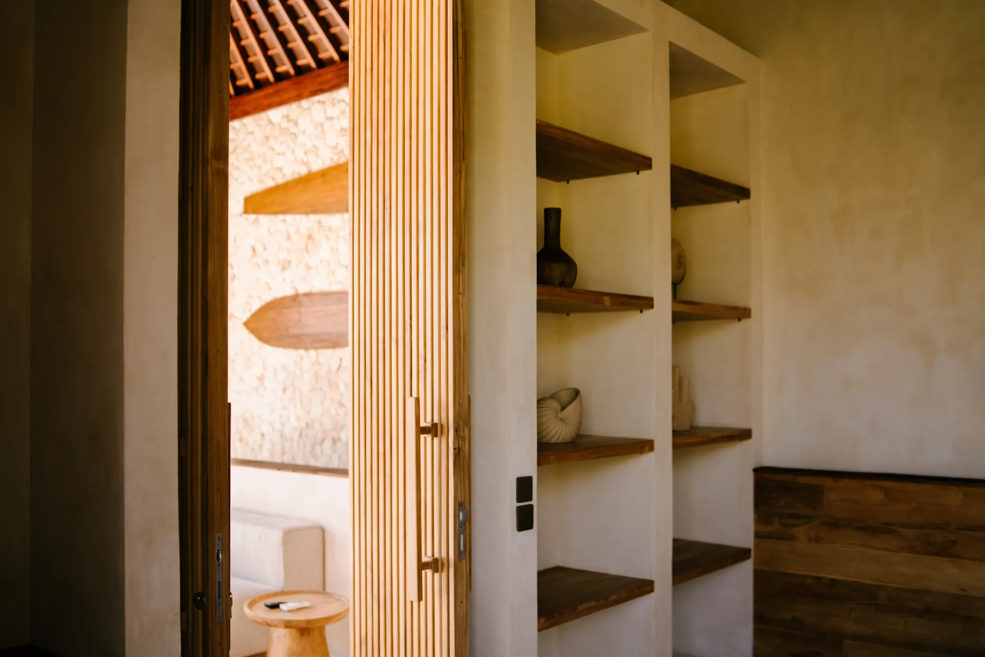 Hallway corridor with wooden doors and shelving display